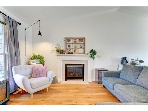 45 Dowler Street, Red Deer, AB - Indoor Photo Showing Living Room With Fireplace