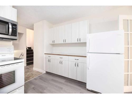 4706 C & E Trail, Lacombe, AB - Indoor Photo Showing Kitchen