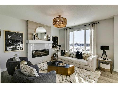 12 Snowberry Lane North, Okotoks, AB - Indoor Photo Showing Living Room With Fireplace