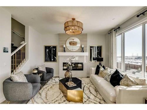 12 Snowberry Lane North, Okotoks, AB - Indoor Photo Showing Living Room With Fireplace