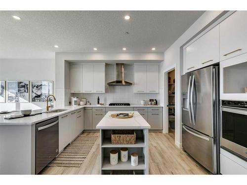 12 Snowberry Lane North, Okotoks, AB - Indoor Photo Showing Kitchen With Stainless Steel Kitchen With Upgraded Kitchen