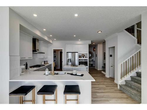 12 Snowberry Lane North, Okotoks, AB - Indoor Photo Showing Kitchen With Stainless Steel Kitchen With Upgraded Kitchen