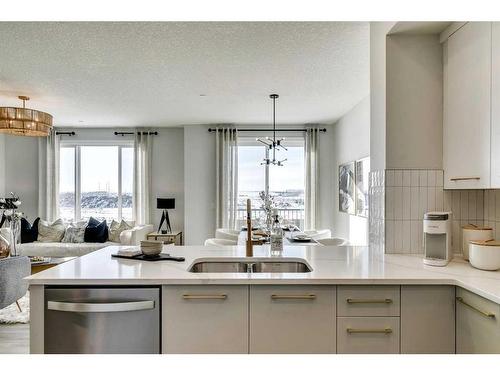 12 Snowberry Lane North, Okotoks, AB - Indoor Photo Showing Kitchen With Double Sink