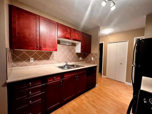 304-7164 Parke Avenue, Red Deer, AB - Indoor Photo Showing Kitchen With Double Sink