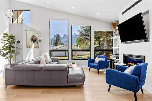 1010 14 Street, Canmore, AB - Indoor Photo Showing Living Room With Fireplace