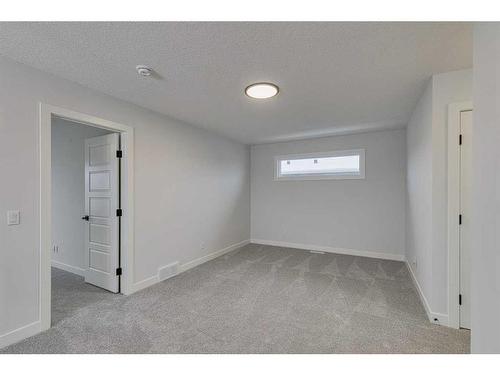 55 Dawson Wharf Mount, Chestermere, AB - Indoor Photo Showing Other Room