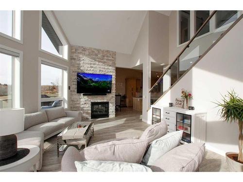 110-25173 Township Road 364, Rural Red Deer County, AB - Indoor Photo Showing Living Room With Fireplace