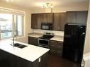 903-125 Caribou Crescent, Red Deer, AB  - Indoor Photo Showing Kitchen With Double Sink 