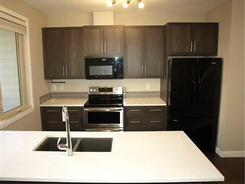 903-125 Caribou Crescent, Red Deer, AB - Indoor Photo Showing Kitchen With Double Sink