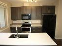 903-125 Caribou Crescent, Red Deer, AB  - Indoor Photo Showing Kitchen With Double Sink 