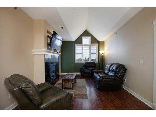 407-4707 50 Street, Sylvan Lake, AB - Indoor Photo Showing Living Room With Fireplace