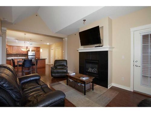 407-4707 50 Street, Sylvan Lake, AB - Indoor Photo Showing Living Room With Fireplace