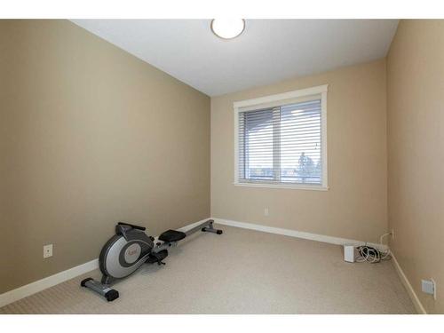 407-4707 50 Street, Sylvan Lake, AB - Indoor Photo Showing Gym Room