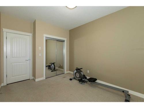 407-4707 50 Street, Sylvan Lake, AB - Indoor Photo Showing Gym Room