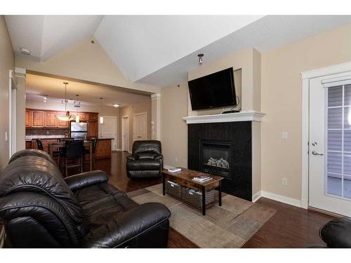 407-4707 50 Street, Sylvan Lake, AB - Indoor Photo Showing Living Room With Fireplace