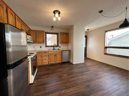 3913 45A Street, Ponoka, AB - Indoor Photo Showing Kitchen With Double Sink