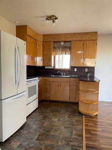 5156 47 Street, Consort, AB - Indoor Photo Showing Kitchen With Double Sink