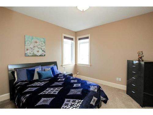 64 Cyprus Road, Blackfalds, AB - Indoor Photo Showing Bedroom