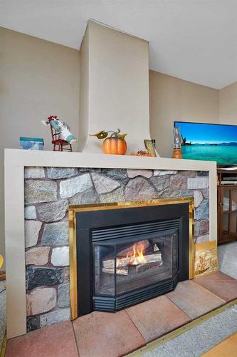 133 Birchcliff Road, Birchcliff, AB - Indoor Photo Showing Living Room With Fireplace