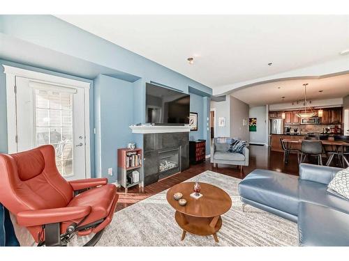 310-4707 50 Street, Sylvan Lake, AB - Indoor Photo Showing Living Room With Fireplace