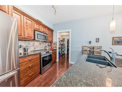 310-4707 50 Street, Sylvan Lake, AB - Indoor Photo Showing Kitchen With Stainless Steel Kitchen With Double Sink