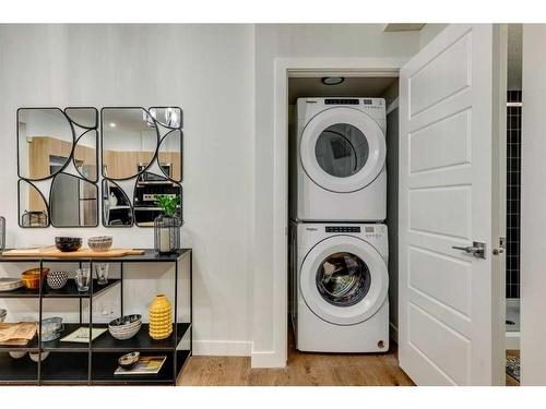 20 Aster Link, Okotoks, AB - Indoor Photo Showing Laundry Room