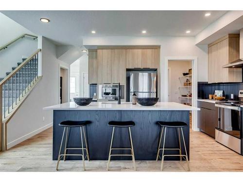 20 Aster Link, Okotoks, AB - Indoor Photo Showing Kitchen With Stainless Steel Kitchen With Upgraded Kitchen