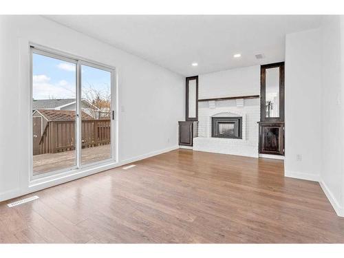 28 Drake Close, Red Deer, AB - Indoor Photo Showing Living Room With Fireplace