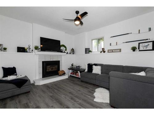 4508 43 Street, Sylvan Lake, AB - Indoor Photo Showing Living Room With Fireplace