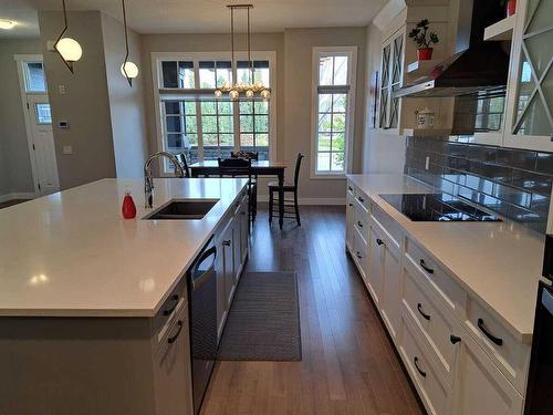 70 Cooperstown Court Sw, Airdrie, AB - Indoor Photo Showing Kitchen With Double Sink