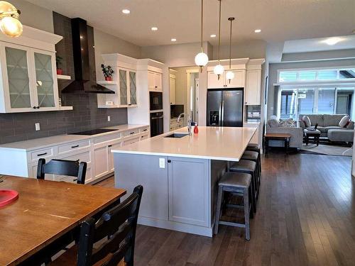 70 Cooperstown Court Sw, Airdrie, AB - Indoor Photo Showing Kitchen With Upgraded Kitchen