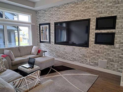 70 Cooperstown Court Sw, Airdrie, AB - Indoor Photo Showing Living Room With Fireplace