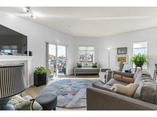 302-9905 81 Avenue Nw, Edmonton, AB - Indoor Photo Showing Living Room With Fireplace