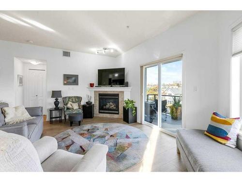 302-9905 81 Avenue Nw, Edmonton, AB - Indoor Photo Showing Living Room With Fireplace