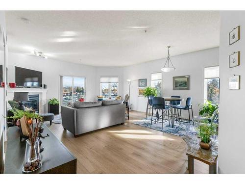 302-9905 81 Avenue Nw, Edmonton, AB - Indoor Photo Showing Living Room With Fireplace