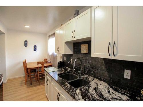 F4-35 Nash Street, Red Deer, AB - Indoor Photo Showing Kitchen With Double Sink