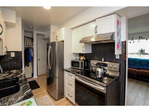 F4-35 Nash Street, Red Deer, AB - Indoor Photo Showing Kitchen With Stainless Steel Kitchen