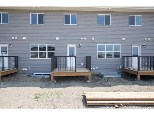 240-248 Halifax Close, Penhold, AB - Outdoor With Deck Patio Veranda With Exterior