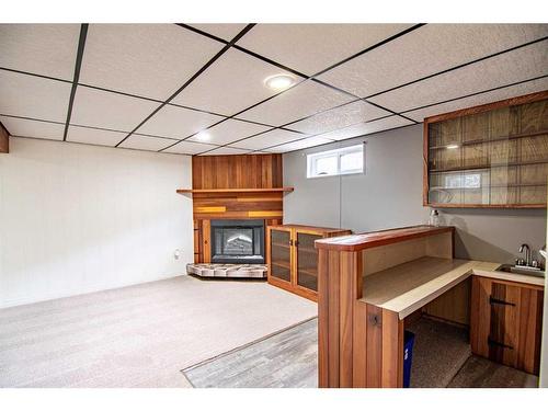 5036 48 Avenue, Bashaw, AB - Indoor Photo Showing Other Room With Fireplace