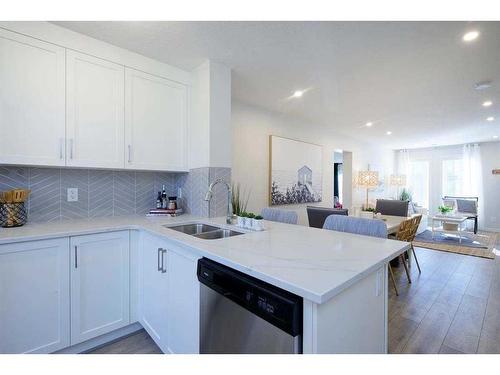 201 Vantage Drive, Cochrane, AB - Indoor Photo Showing Kitchen With Double Sink