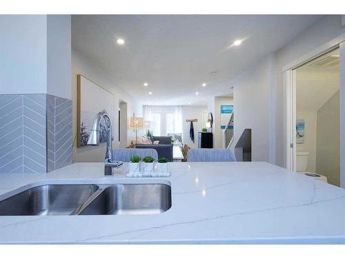 201 Vantage Drive, Cochrane, AB - Indoor Photo Showing Kitchen With Double Sink