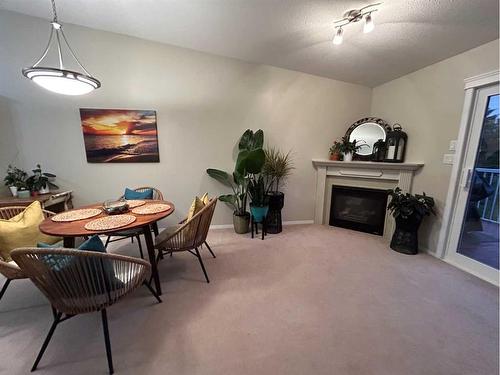 4527 71 Street Close, Camrose, AB - Indoor With Fireplace