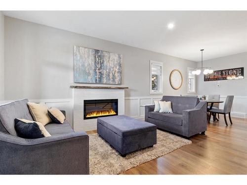 2-5324 49 Avenue, Lacombe, AB - Indoor Photo Showing Living Room With Fireplace