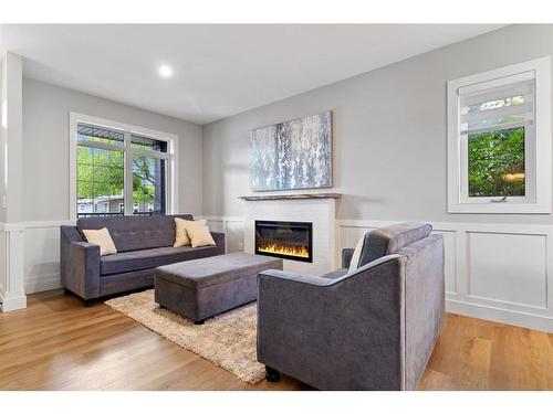 2-5324 49 Avenue, Lacombe, AB - Indoor Photo Showing Living Room With Fireplace