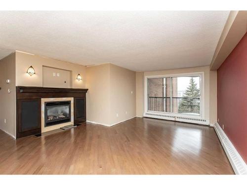 402-4326 Michener Drive, Red Deer, AB - Indoor Photo Showing Living Room With Fireplace