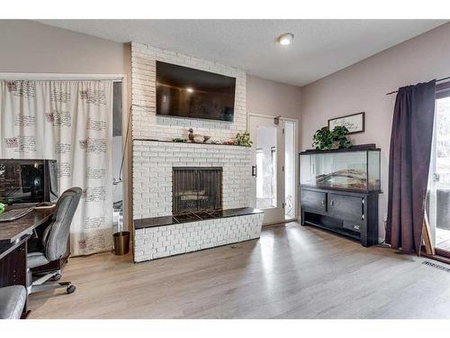 35 Odell Green, Red Deer, AB - Indoor Photo Showing Other Room With Fireplace