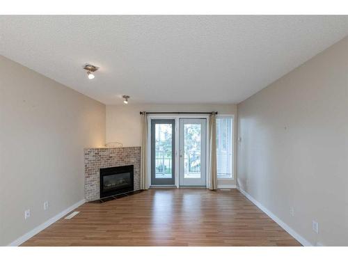 606-5220 50A Avenue, Sylvan Lake, AB - Indoor Photo Showing Living Room With Fireplace