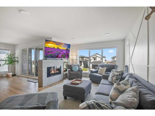 4162 Ryders Ridge Boulevard, Sylvan Lake, AB - Indoor Photo Showing Living Room With Fireplace