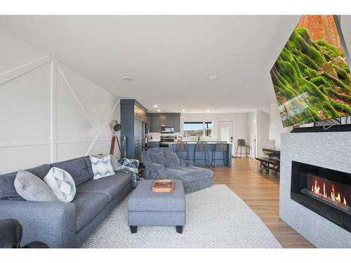 4162 Ryders Ridge Boulevard, Sylvan Lake, AB - Indoor Photo Showing Living Room With Fireplace