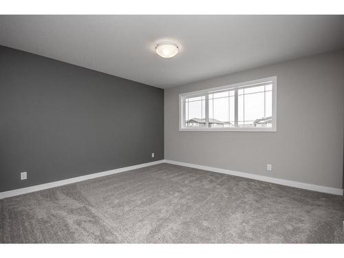 122 Mann Drive, Penhold, AB - Indoor Photo Showing Other Room